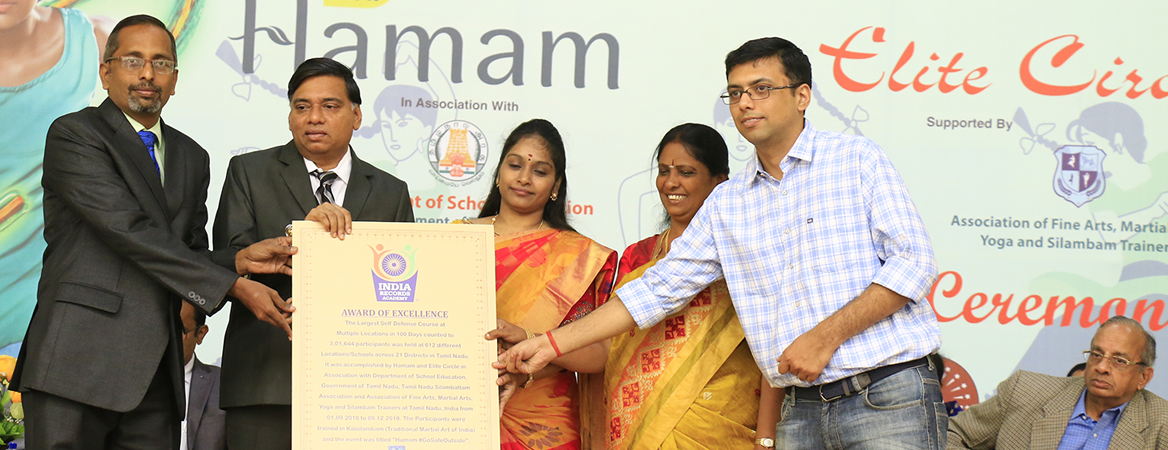 Indian Book of Records certificate being presented to recipients at an award ceremony